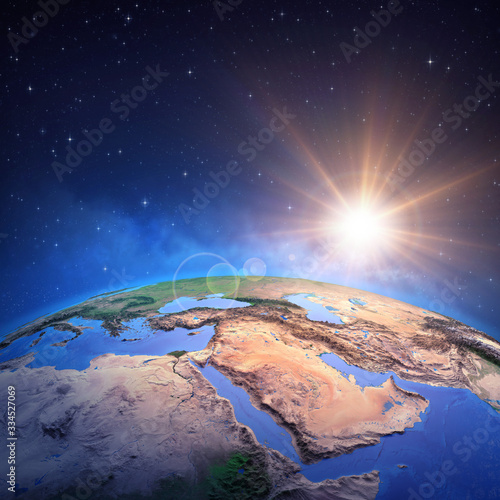 Fototapeta Naklejka Na Ścianę i Meble -  Sun shining over Middle East from space
