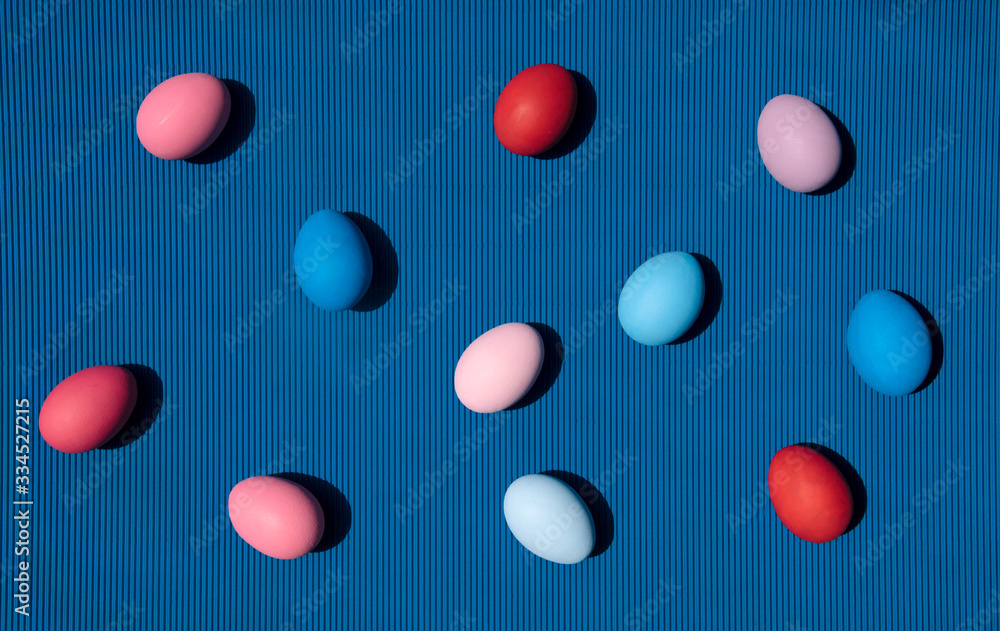 Painted eggs on blue background.