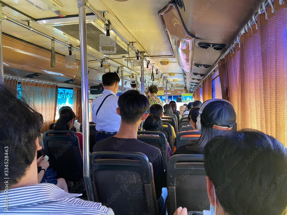 Bangkok, Dusit / Thailand - March 12, 2020: The way of life of the crowd traveling by bus number 515 in Bangkok, Thailand in the morning. Bangkok, Dusit / Thailand - March 12, 2020: The way of life of the crowd traveling by bus number 515 in Bangkok, Thailand in the morning.