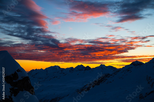 Obraz na płótnie Colorful winter sunset on the top of Mons Avium Peak in Switzerland. w salonie