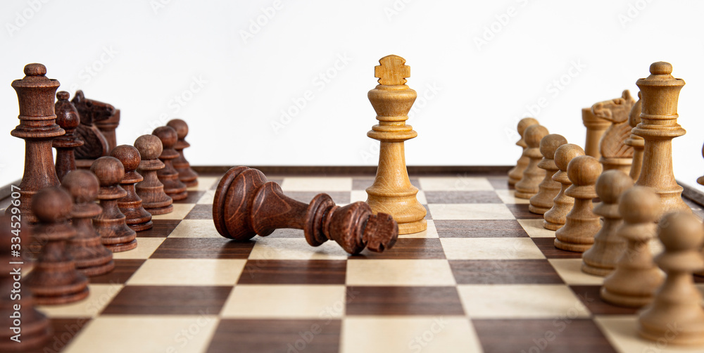 Chess pieces lined up on the chessboard with fighting kings. Concept picture concerning decision making and strategy. Chess pieces lined up on the chessboard with fighting kings. Concept picture concerning decision making and strategy.