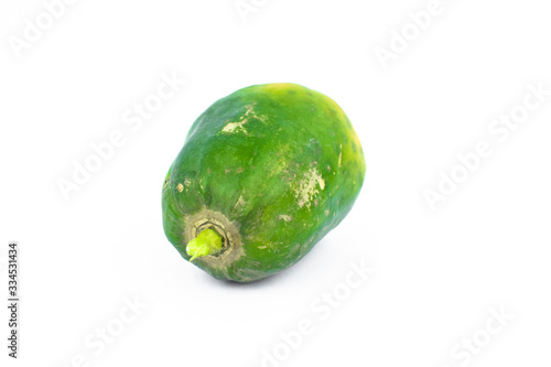 Portrait of a fresh green medium sized papaya fruit isolated on a white background