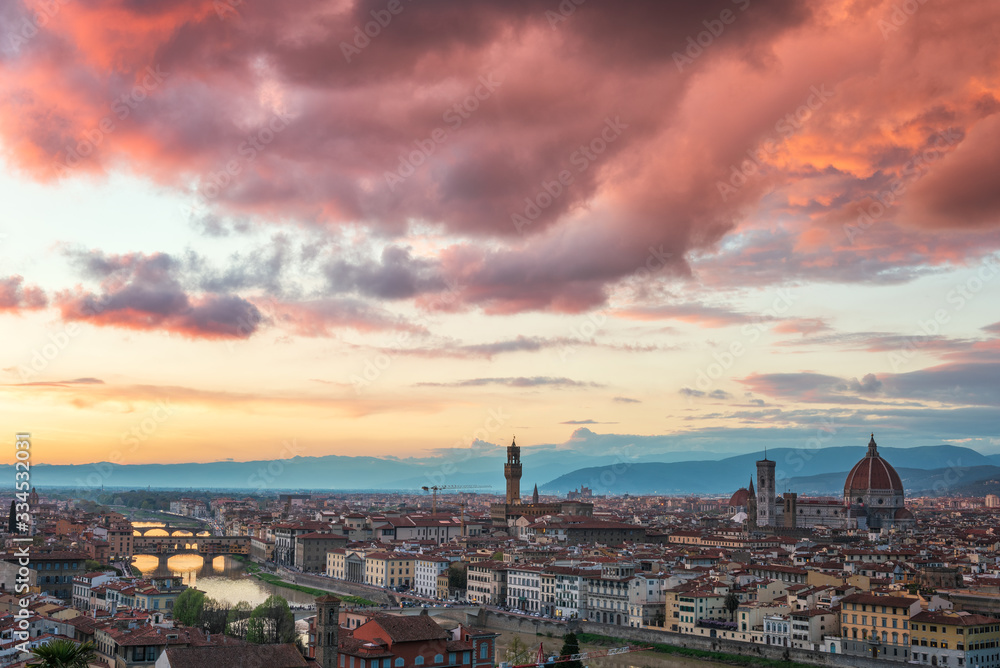 Amazing colorful sunset view of Florence city, Italy with the river Arno and Cathedral of Santa Maria del Fiore.