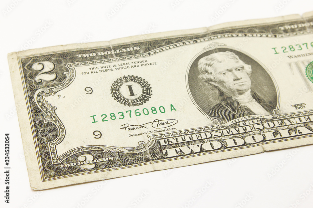 Two dollar bills in cash on white background Two dollar bills in cash on white background