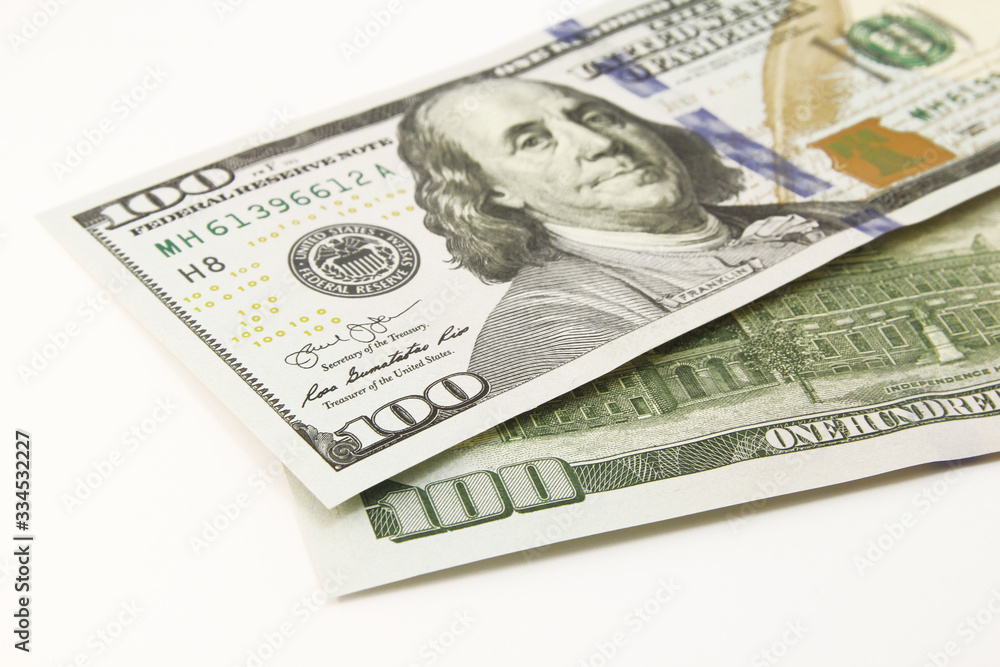 One hundred dollar cash banknotes on white background One hundred dollar cash banknotes on white background