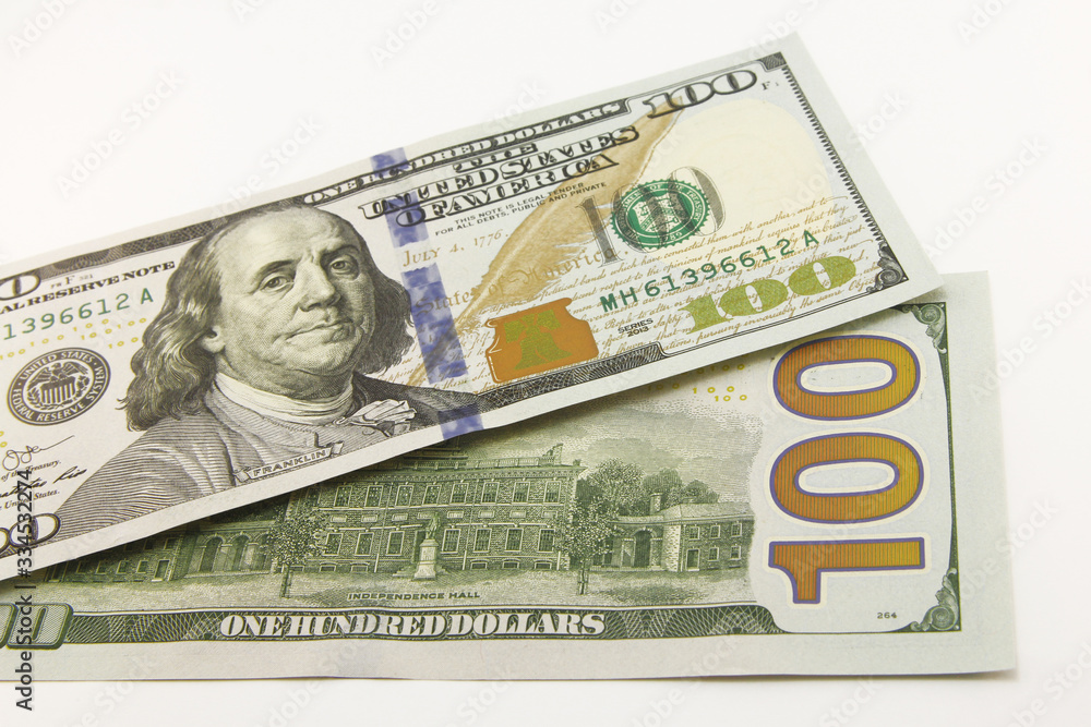One hundred dollar cash banknotes on white background One hundred dollar cash banknotes on white background