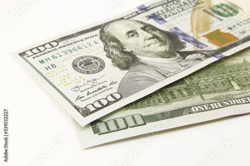 One hundred dollar cash banknotes on white background
