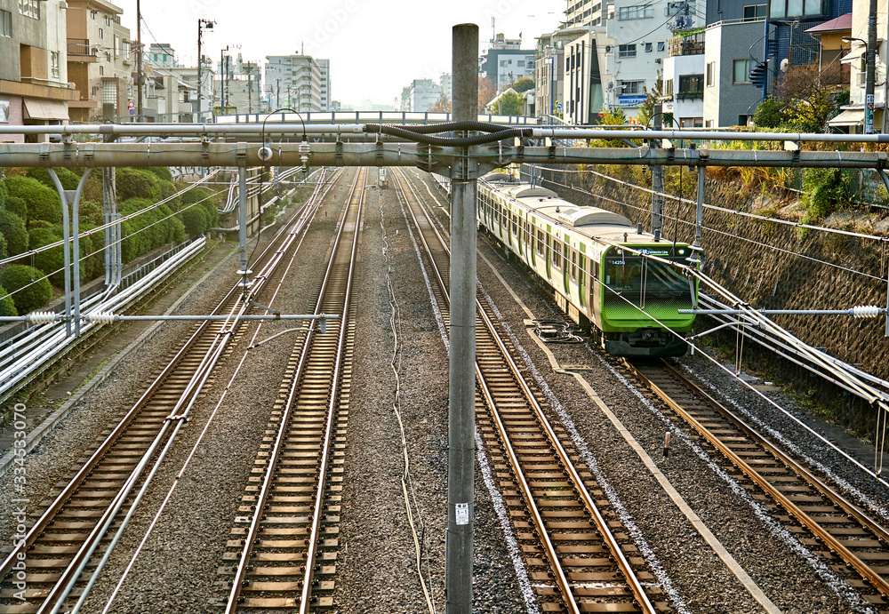 Train goes through one of many railroad in Tokyo