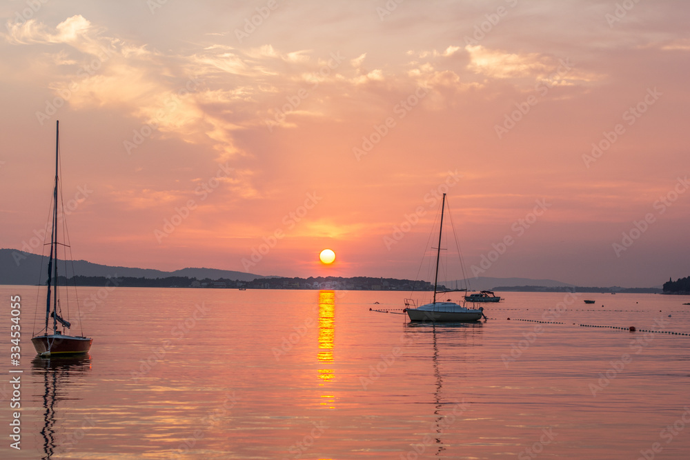 croatia sibenik summer holiday tourist destination vie of red sunset sea with boat 