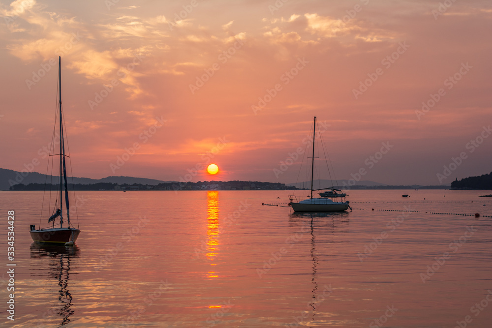 croatia sibenik summer holiday tourist destination vie of red sunset sea with boat 