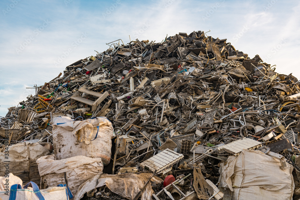 Huge mountain of mainly metal garbage in a junkyard Huge mountain of mainly metal garbage in a junkyard