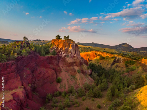 Beautiful landscape of the remains of an old sleeping volcano crater with red clay and vibrant colors  Racos  Brasov County  Transylvania  Romania