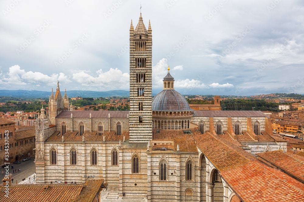 View of Siena Cathedral (Duomo di Siena) and Piazza del Duomo in Siena, Italy