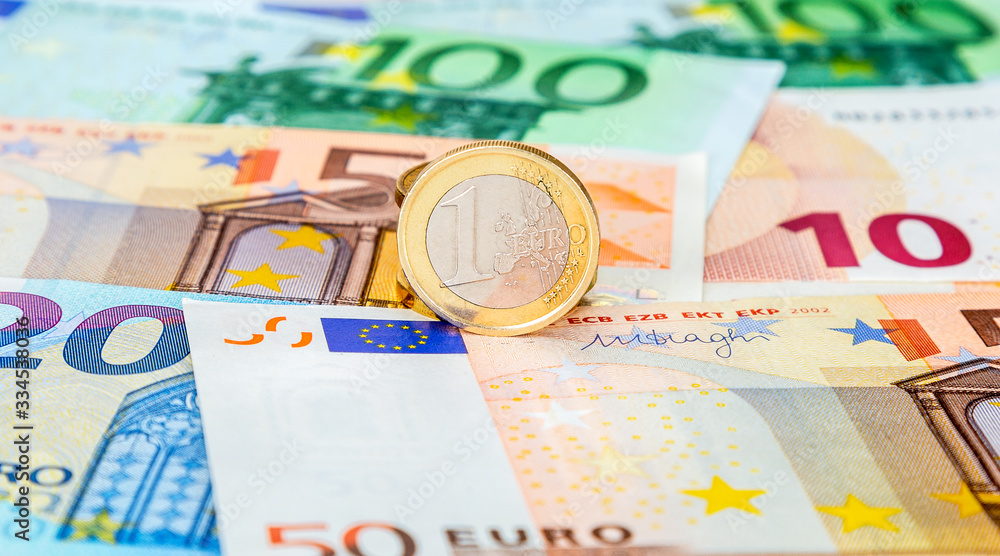 Money background from currency of euro banknotes with one euro coin Money background from currency of euro banknotes with one euro coin