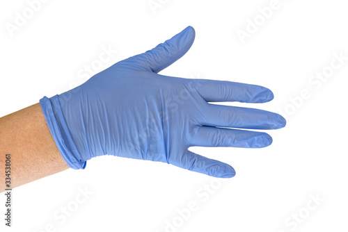 Fototapeta Naklejka Na Ścianę i Meble -  Hand of woman with blue medical glove isolated on white background