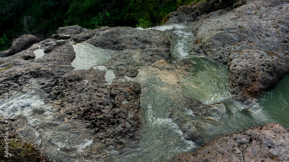 Cliffs with soft waterfalls in the hills Cliffs with soft waterfalls in the hills