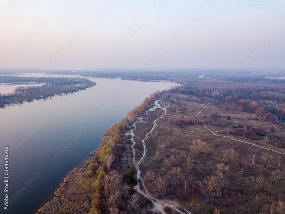 Landscape: blue hour over the Dnieper River in Kiev. Aerial drone view.