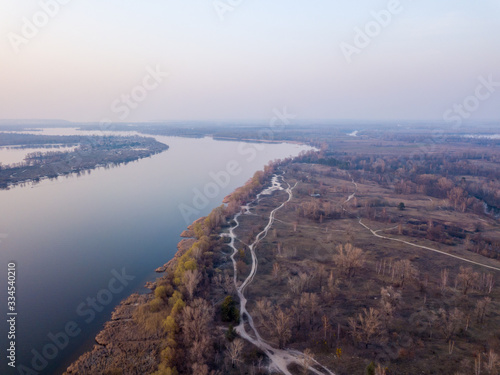 Landscape: blue hour over the Dnieper River in Kiev. Aerial drone view.