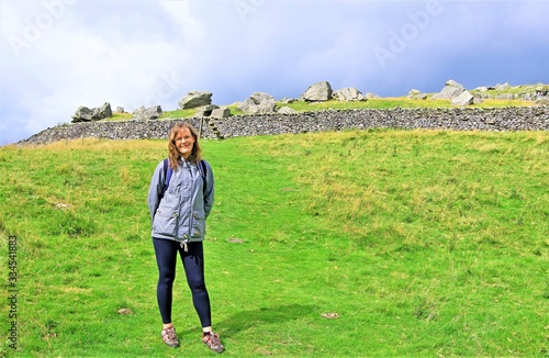Female hiking, by the Norber Erratics, in the Yorkshire Dales photo