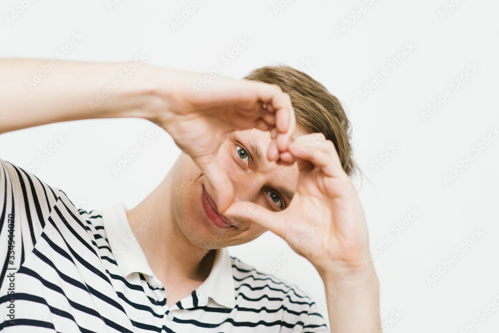 man making a hand heart frame man making a hand heart frame