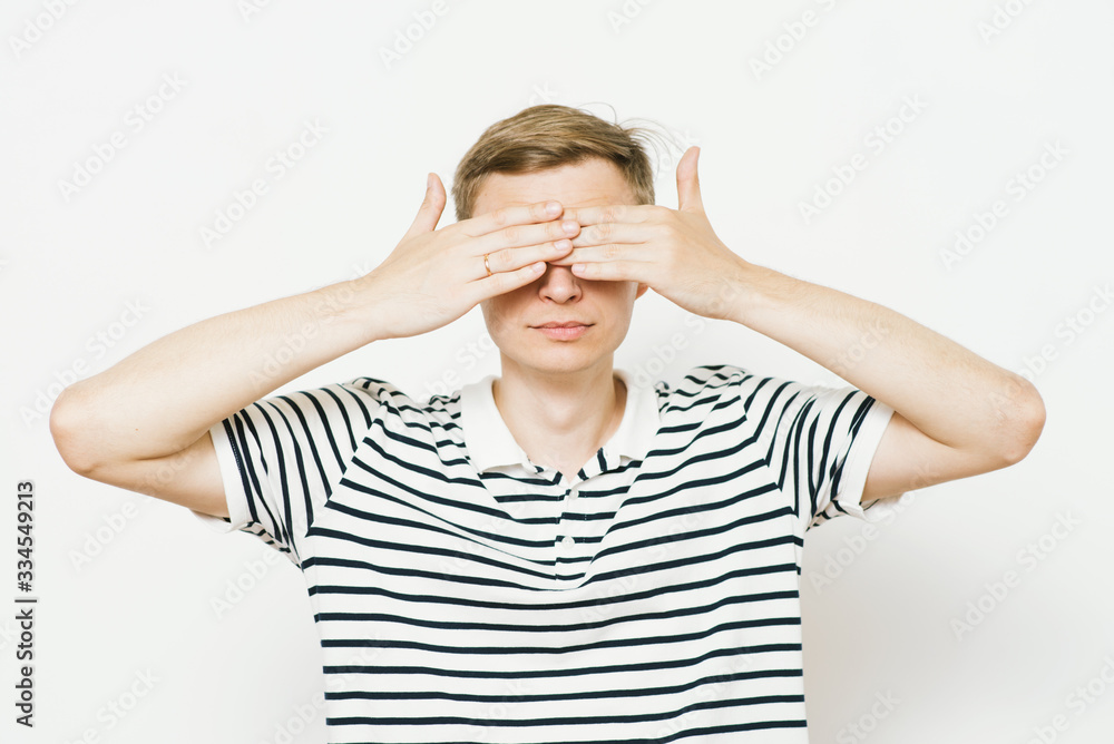 Man closes eyes with her hands Man closes eyes with her hands