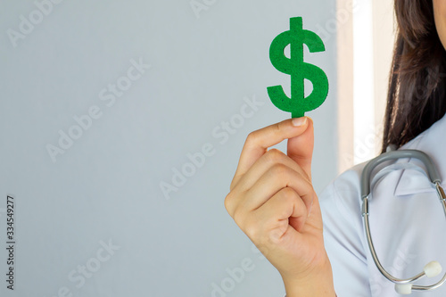 Dollar symbol and medical costs concept photo