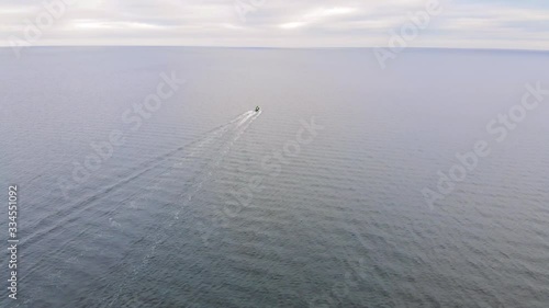Motorboat driving into the sea