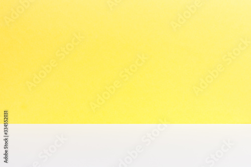 Empty of wood white table top on yellow pastel color background.For montage product display or design key visual layout.