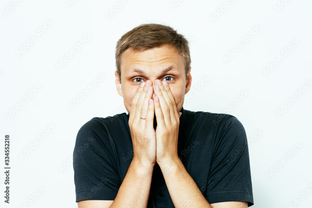 man laughs and covers her mouth