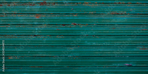 Old galvanized green steel wall rusty background texture