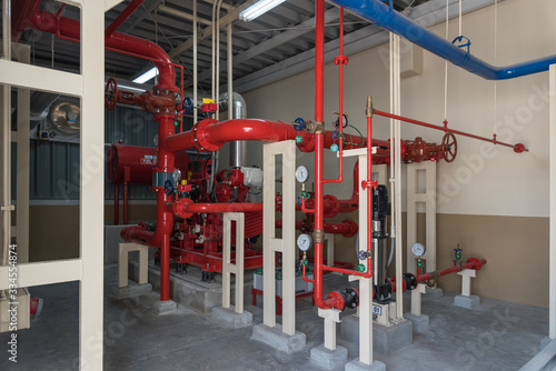 Industrial fire pump of sprinkler valve station and emergency fire alarm system room of safety and security system in factory.