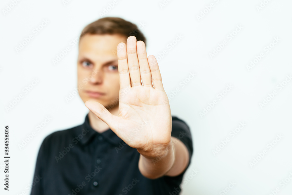 Businessman shows stop gesture Businessman shows stop gesture