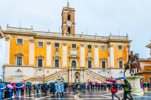 Rome, Italy. Tourists line in front Palazzo Senatorio by equestrian monument of Marcus Aurelius in Piazza del Campidoglio Square on Capitoline Hill, beside Palazzo dei Conservatori.