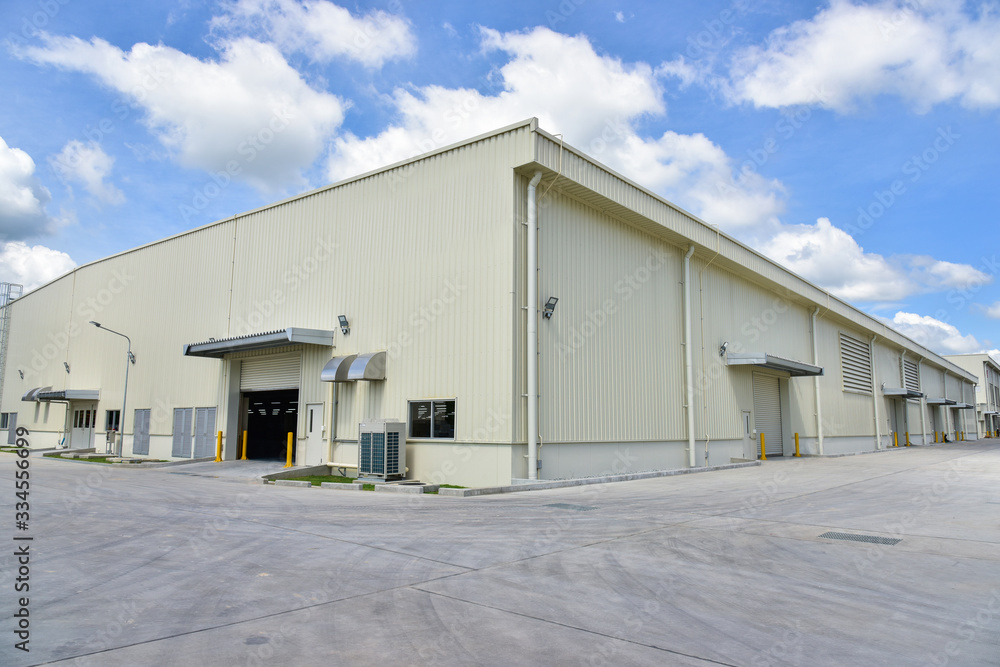 Newly industrial warehouse building with blue sky Newly industrial warehouse building with blue sky