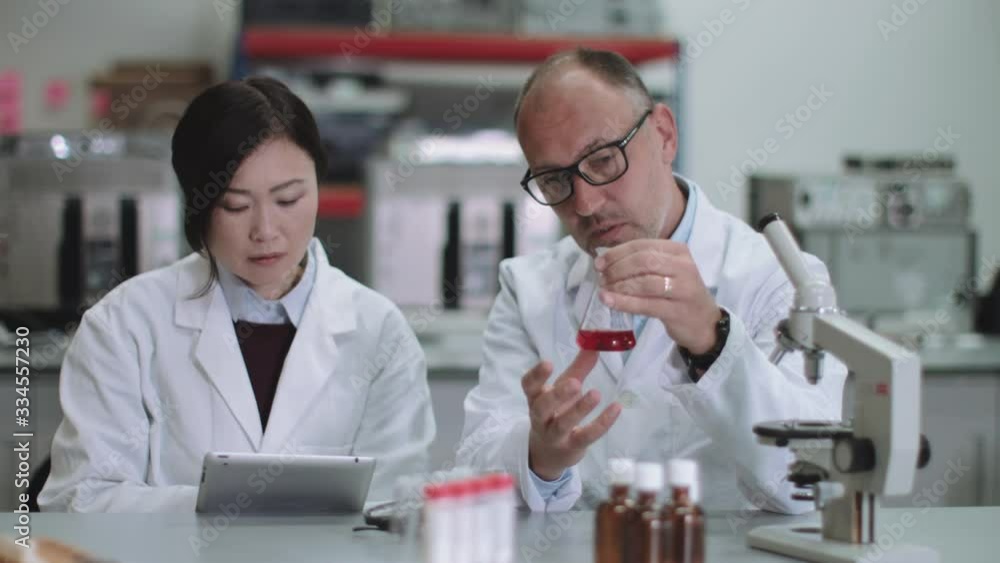 Scientist team working in laboratory Scientist team working in laboratory