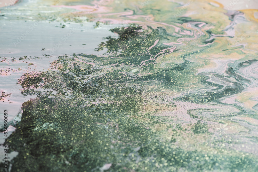 Fantasy fluid art background with dark green, orange and pink tints. Dirty marble effect of acrylic paints. Chaotic liquid ink of oxide tones. Toxic surrealistic abstract texture with mix marsh colors Fantasy fluid art background with dark green, orange and pink tints. Dirty marble effect of acrylic paints. Chaotic liquid ink of oxide tones. Toxic surrealistic abstract texture with mix marsh colors