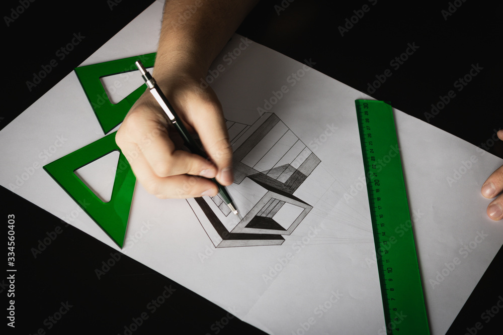 Fotka „Dibujando una casa moderna en perspectiva cónica con dos puntos de  fuga con escuadra y cartabón de color verde sobre un escritorio negro“ ze  služby Stock | Adobe Stock