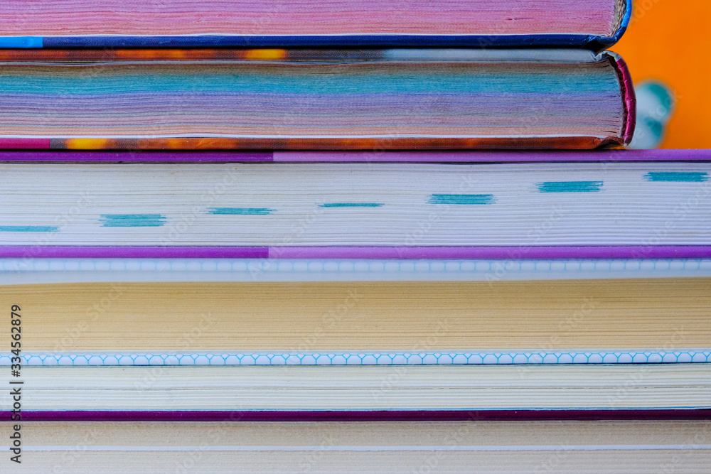 pile of school books, closeup of stacked old books pile of school books, closeup of stacked old books