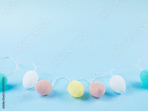 Easter pastel color eggs on blue monochrome background