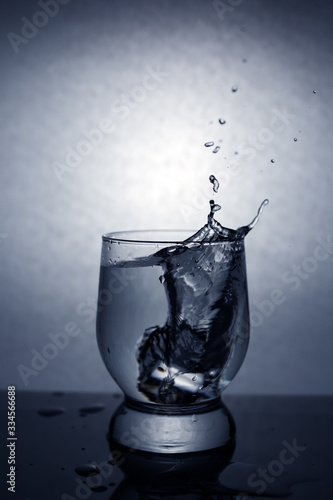 splashing from a glass when throwing ice cubes, vignetting