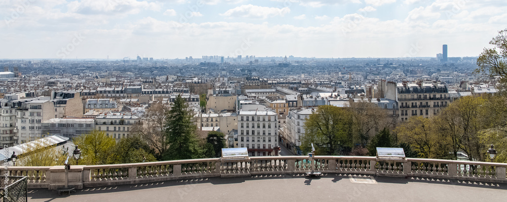 Paris, panorama of the city, from Montmartre hill, typical roofs, sunny day Paris, panorama of the city, from Montmartre hill, typical roofs, sunny day