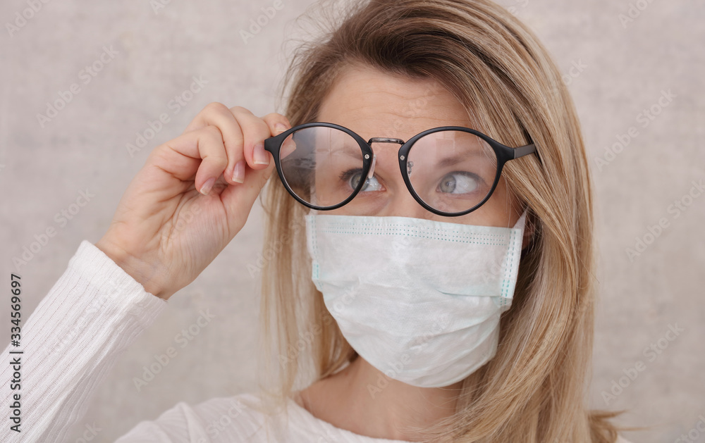 Medical mask and Glasses fogging. Avoid face touching, Coronavirus prevention, Protection. - obrazy, fototapety, plakaty 