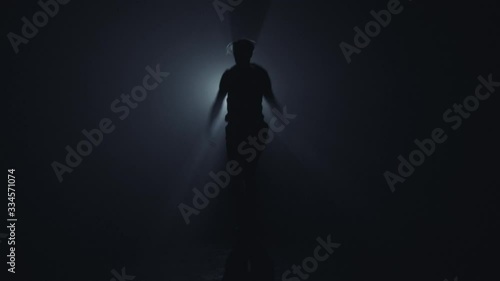 Guy jumping in dark