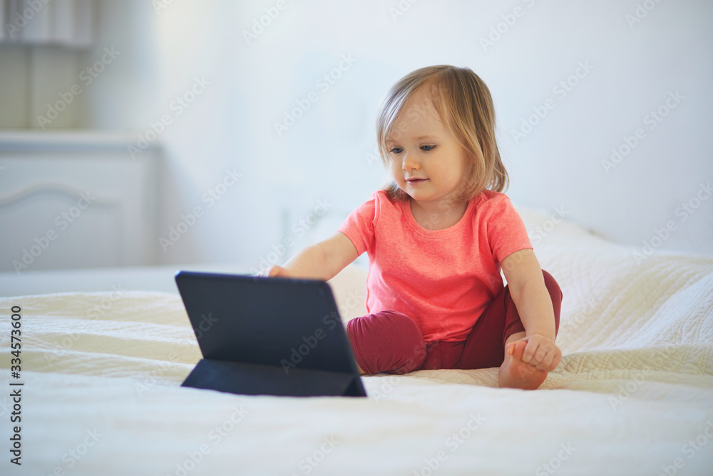 Toddler girl with digital tablet at home Toddler girl with digital tablet at home