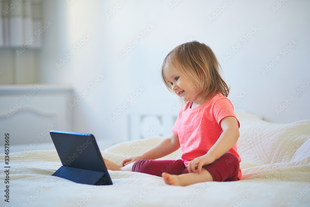 Toddler girl with digital tablet at home Toddler girl with digital tablet at home