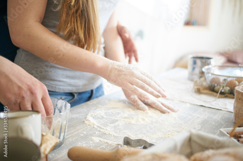 women's and men's hands mix wheat flour. baker's hand closeup.couple together Cooking pizza, bread