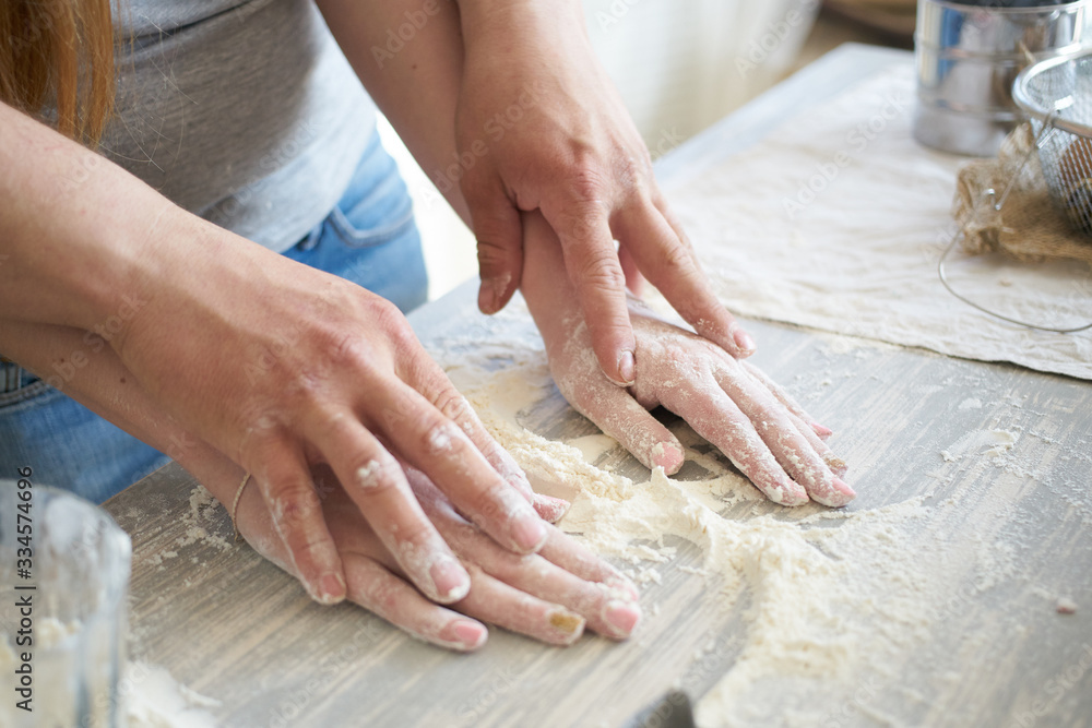 women's and men's hands mix wheat flour. baker's hand closeup.couple together Cooking pizza, bread