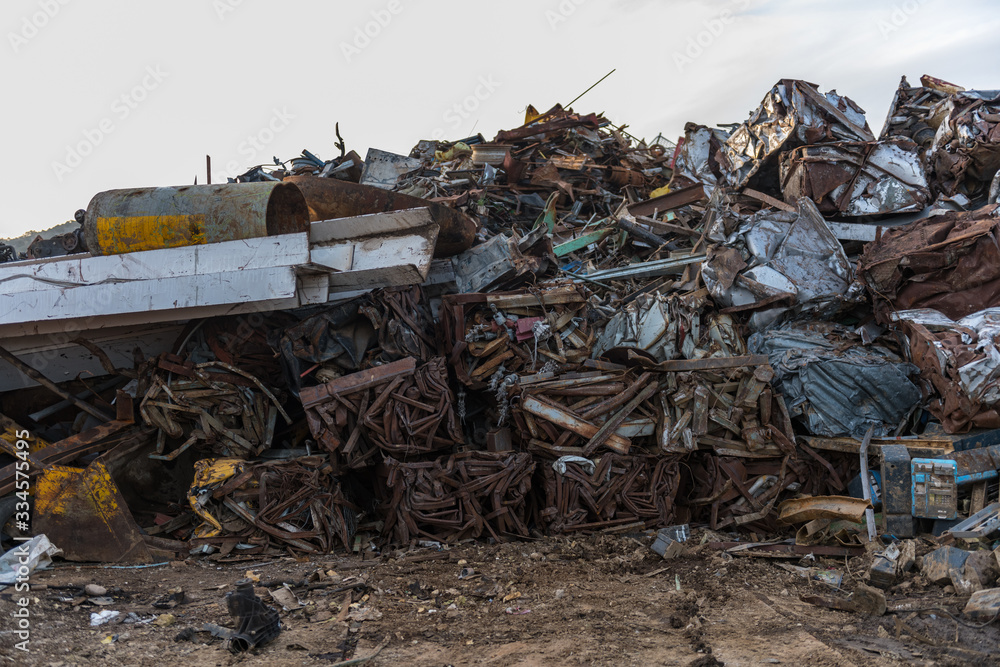Stacks of cubes of metal pieces in a scrap yard