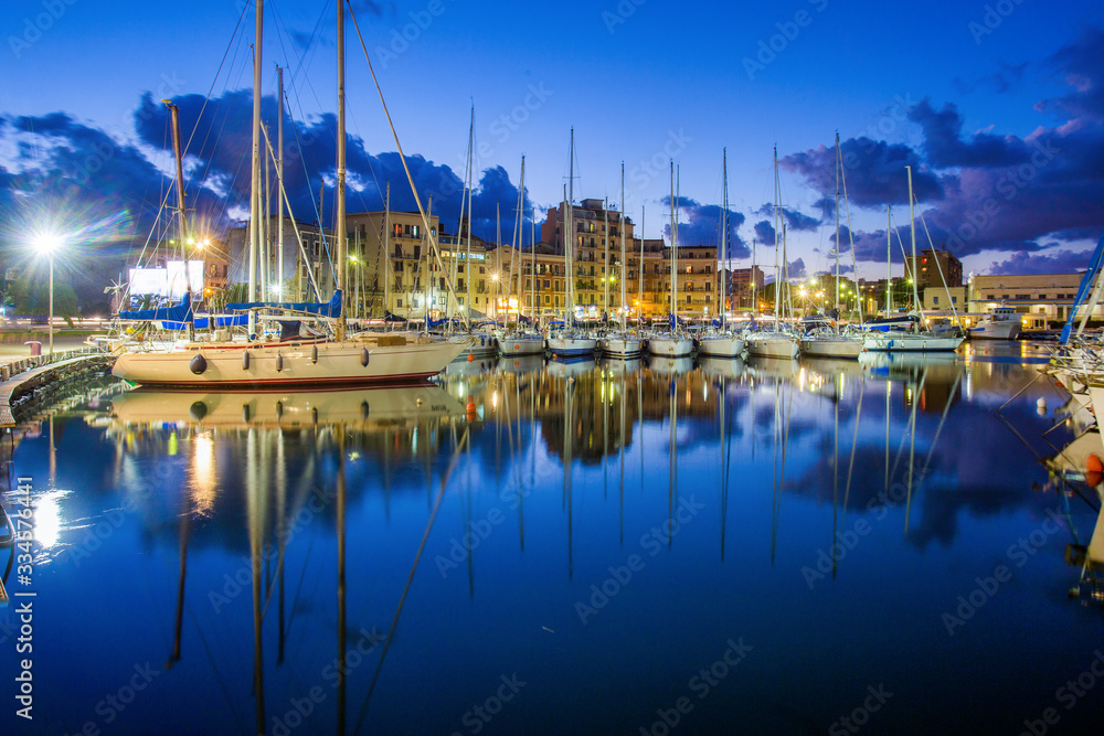 Idyllic view on Sailboats in harbor of Palermo - idyllic blue time in the city