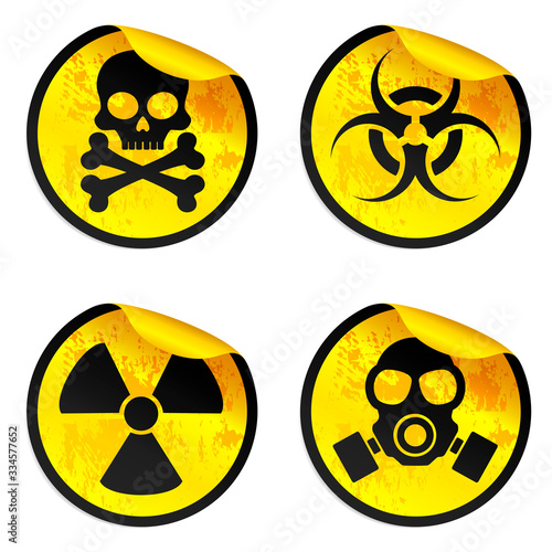 Danger yellow stickers set. Radiation warning sign, biohazard warning sign, gas mask warning sign, toxic warning sign. Vector illustration